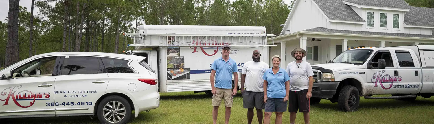 Killians Gutters and Screens crew in front of all vehicles