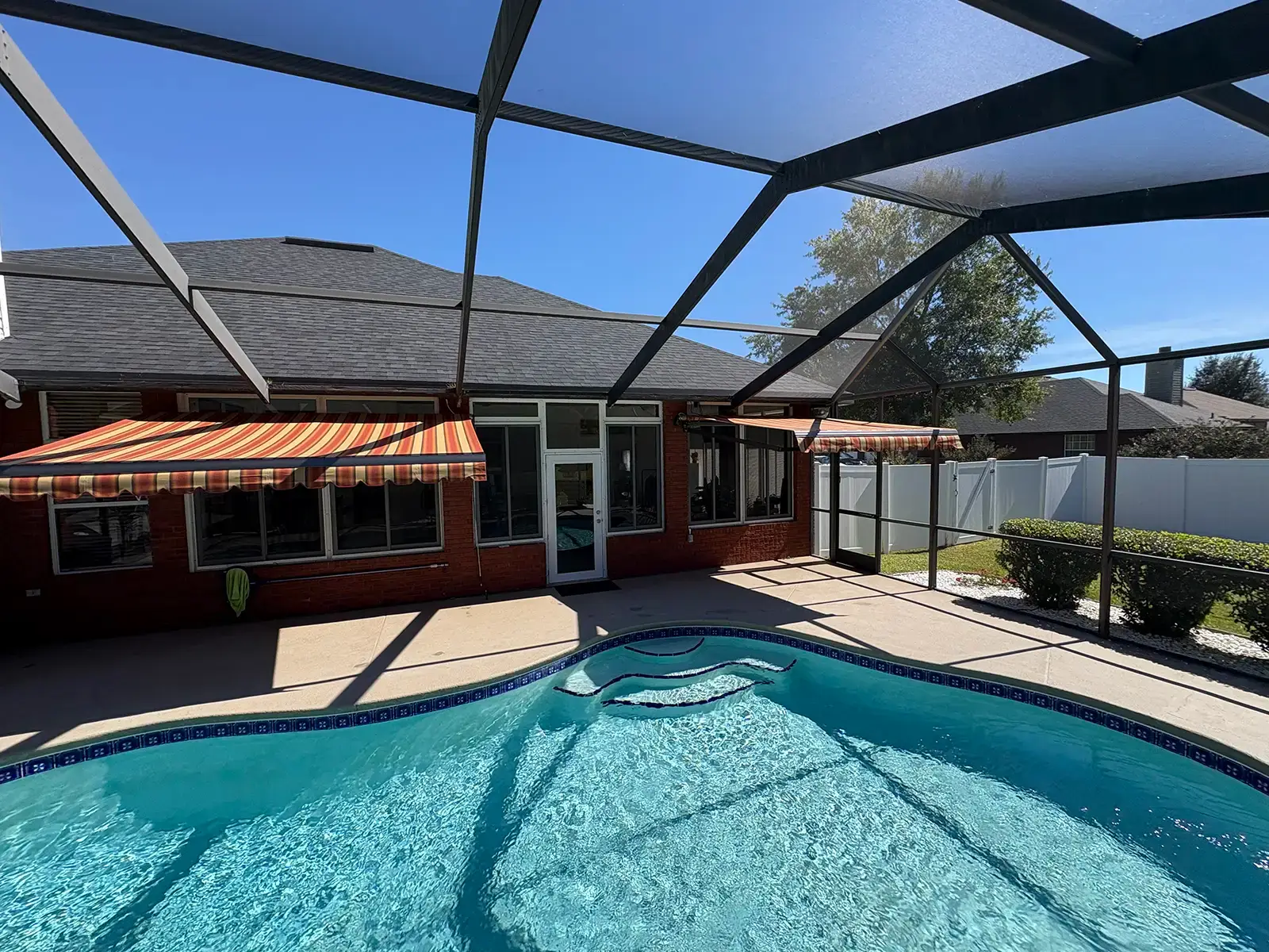 Two poolside motorized awnings - Palm Coast Florida