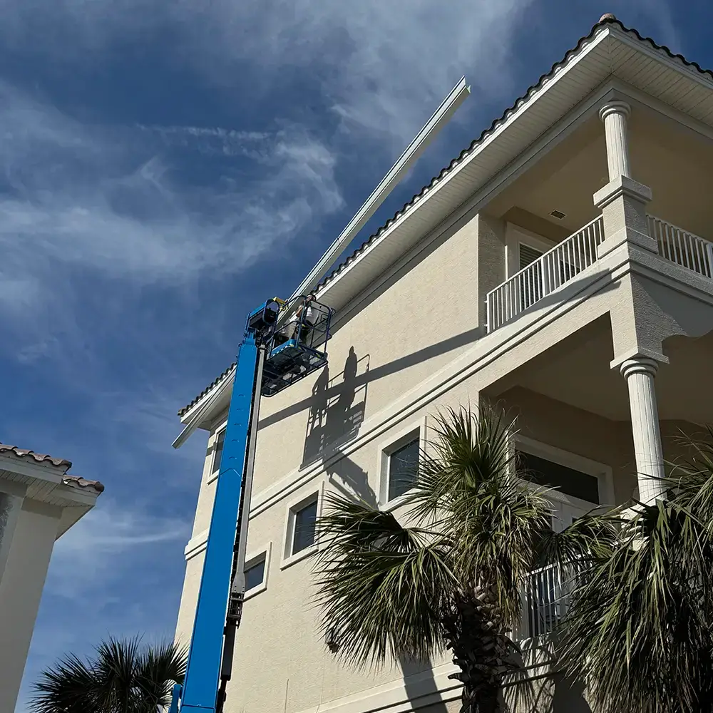 Gutter installers on boom lift – Flagler Beach Florida